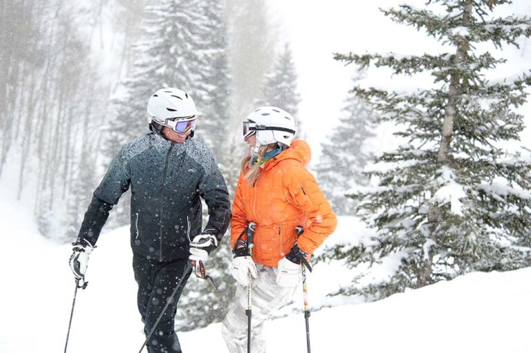 Couple skiing in Vail, CO.